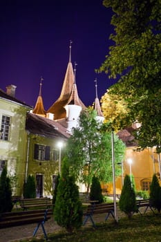 Brasov, Romania - July 24, 2013: Ecaterina Gate tower backyard illuminated at night, Brasov, Romania