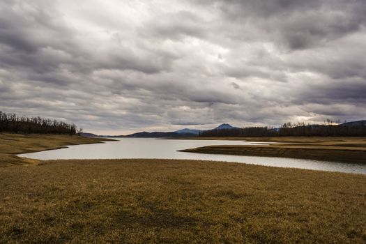 Plastiras lake view with dramatic cloudy sky, in central Greece