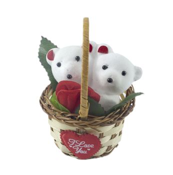 A cute white teddy bears with with rose in basket.