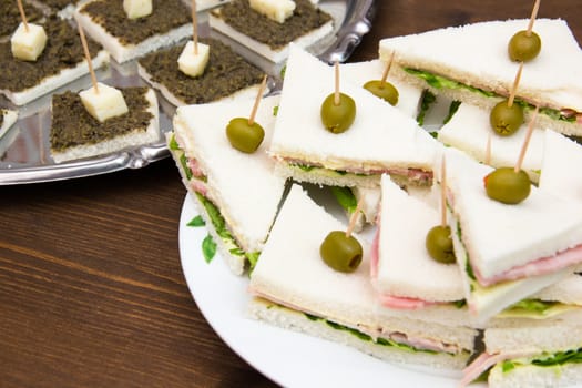 Appetizers on wooden table seen up close