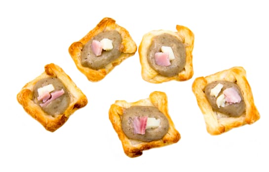 Appetizers of puff pastry on a white background