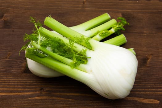 Fennel on wooden table seen from above