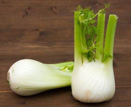 Fennel on wooden table seen up close