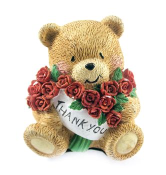 cute teddy bear couple holding red rose.