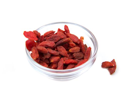 Goji berries on bowl on white background