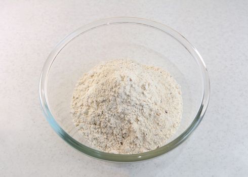 Malted bread flour mix with mixed seeds in a glass bowl