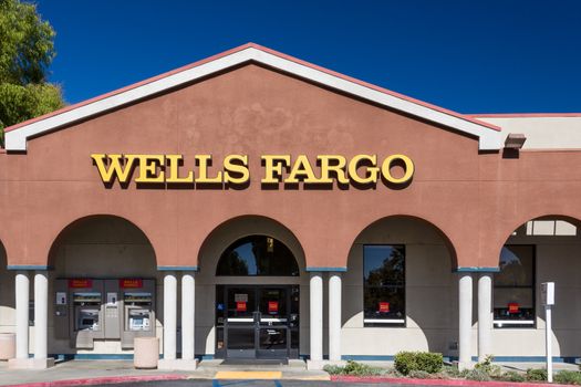 VALENCIA, CA/USA - AUGUST 17, 2014. Wells Fargo bank exterior. Wells Fargo & Company is an American multinational banking and financial services holding company headquartered in San Francisco, California.