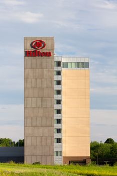 BLOOMINGTON, MN/USA - JUNE 22, 2014: Hilton hotel exterior. Hilton is an international chain of full service hotels and resorts and the flagship brand of Hilton Worldwide.