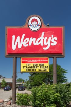 BLOOMINGTON, MN/USA - JUNE 24, 2014:  Wendy's fast food restaurant exterior and sign. Wendy's is the world's third largest hamburger fast food chain with approximately 6,650 locations.