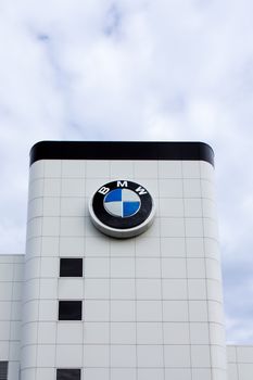 BLOOMINGTON, MN/USA - JUNE 22, 2014: BMW automobile dealership exterior. Bavarian Motor Works is a German automobile, motorcycle and engine manufacturing company founded in 1916.