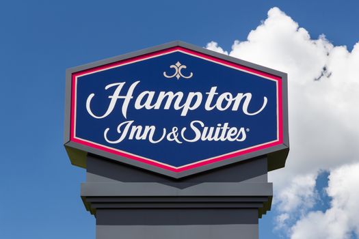 BLOOMINGTON, MN/USA - JUNE 24, 2014: Hampton Inn and Suites sign. Hampton Inn and Suites is a brand of independently owned hotels trademarked by Hilton Worldwide.