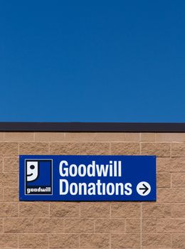 BLOOMINGTON, MN/USA - JUNE 21, 2014:  Goodwill store exterior sign. Goodwill Industries is a nonprofit organization that provides job training programs for people with disabilities.