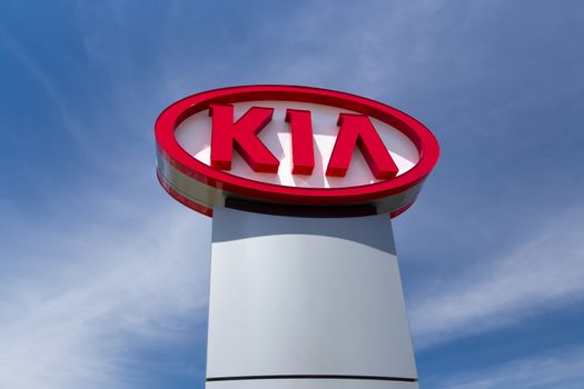 SAN JOSE,CA/USA - MAY 24, 2014: Kia Autombile Dealership Sign. Kia is a South Korean manufacturer of automobiles and commercial vehicles.