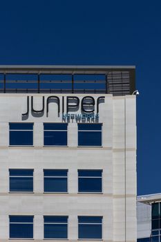SANTA CLARA, CA/USA - MAY 11, 2014:  Juniper Networks Building in Silicon Valley. Juniper Networks, Inc. is an American manufacturer of networking equipment.
