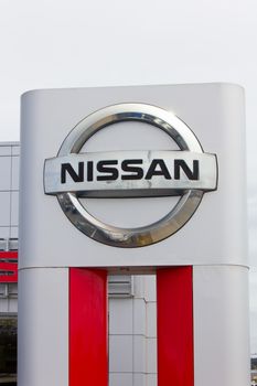 MONTEREY, CA/USA - MAY 8, 2014:  Nissan Motors automobile dealership and sign.  Nissan Motors is is a Japanese multinational automotive manufacturer headquartered in Japan.