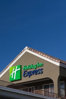 LANCASTER, CA/USA - APRIL 20 2014: Holiday Inn Express Sign motel exterior. Holiday Inn Express is a mid-priced hotel chain branded by InterContinental Hotels Group.
