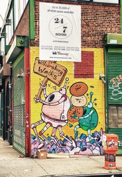 BROOKLYN - JUNE 15, 2013: Art on buildings wall. Brooklyn is famous for graffiti on many buildings wall.