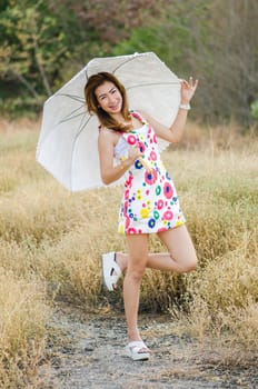 Charming woman on meadow, model is a asian girl.