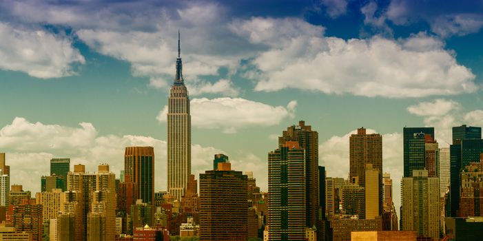 New York City Manhattan midtown aerial panorama view with skyscrapers and beautiful sunset sky.