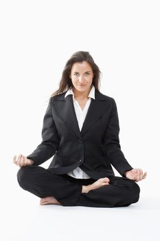 beautiful businesswoman in black suit exercising yoga - clipping path