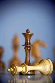 chess game - black king standing over white king - checkmate