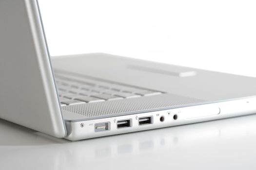 open thin silver laptop computer on white - side view