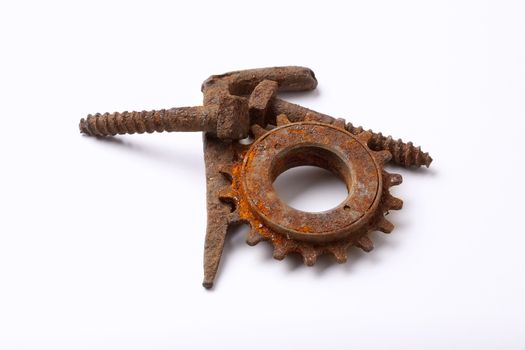 rusty old bolts and cogwheel isolated on white background - clipping path