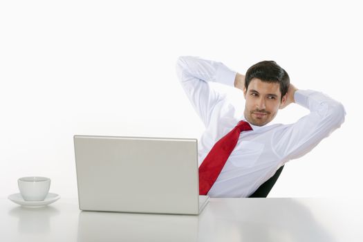 young business executive in white shirt behind desk with laptop