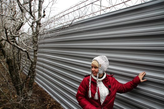 Krasnodar region, Russia - March 23, 2012. The ecologist Evgenia Chirikova near a fence of a cottage of the governor Tkachyov in the protected wood