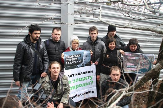 Krasnodar region, Russia - March 23, 2012. Action of ecologists in support of Suren Gazaryan, near a fence of a cottage of the governor Tkachyov in the protected wood