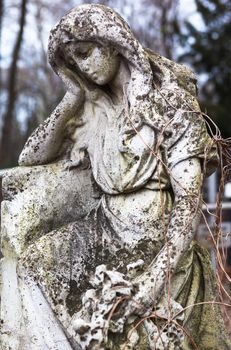 Old cemetery marble sculpture of the angel.