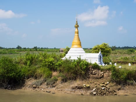Small, primitive Buddhist pagoda among rice fields near Mrauk U, Rakhin State in Western Myanmar.
