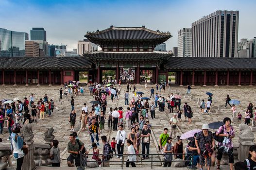 Gyeongbokgung palace in Seoul in South Korea and a lot of visitors from all over the world