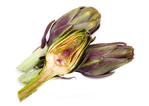 Artichoke cut in half on white background seen from above