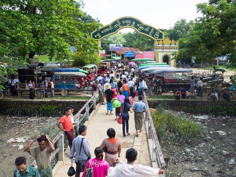 Mrauk U, Rakhin State, Myanmar - October 16, 2014: The ferry pier at the inland town Mrauk U in the Rakhin State, Myanmar during the arrival of the daily boat from Sittwe.