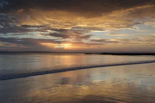 Beautiful sunset colours and peaceful tranquil waters at Cabbage Tree Beach, Jervis Bay Australia