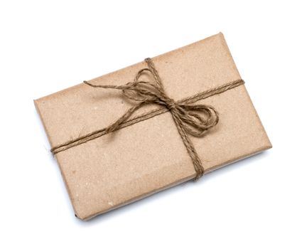 parcel wrapped with brown kraft paper isolated on white background