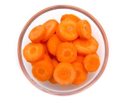 Carrot slices on white bowl on top views