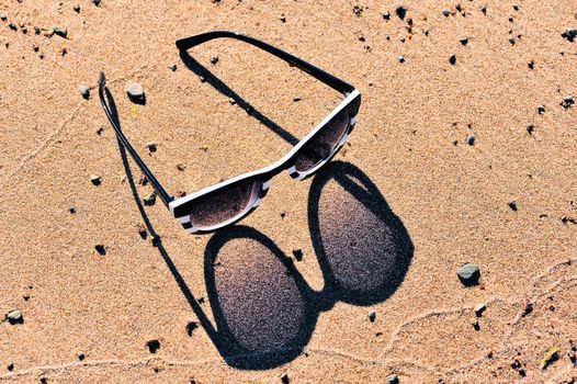 Plastic sunglasses on the beach