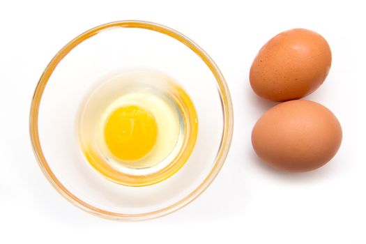 Open egg on bowl on white background seen from above