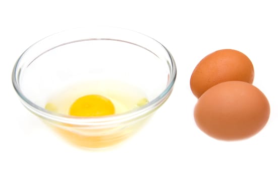 Open egg on bowl on white background