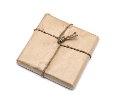 parcel wrapped with brown kraft paper isolated on white background