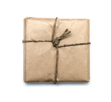 parcel wrapped with brown kraft paper isolated on white background