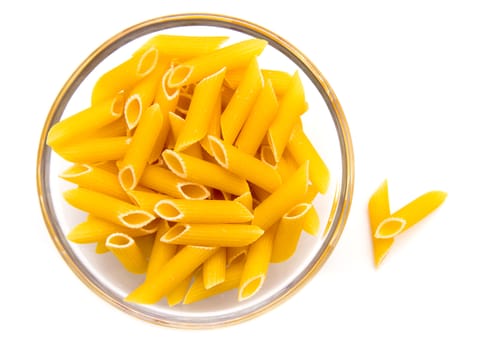 Glass bowl with pasta on white background top view