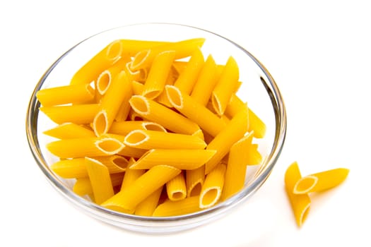 Glass bowl with pasta on white background