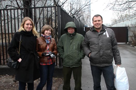 Moscow, Russia - April 13, 2012. The politician Nikolay Lyaskin who is just released from under arrest is photographed against prison with the political activists meeting him. Among meeting Konstantin Lebedev and Olga Pakhtusova. Lyaskin was arrested for attempt to place protest tent into the Red Square