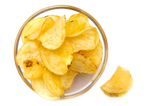 Bowl with potato chips on white background top view