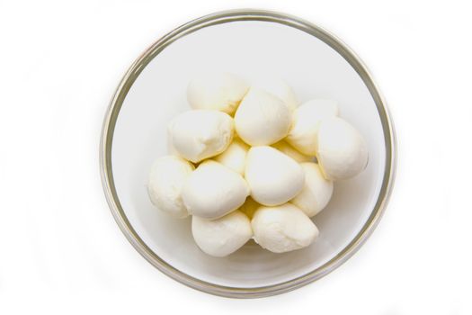 Small mozzarella in bowl on white background viewed from above