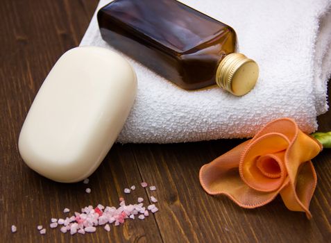 Products for body care on dark wood table