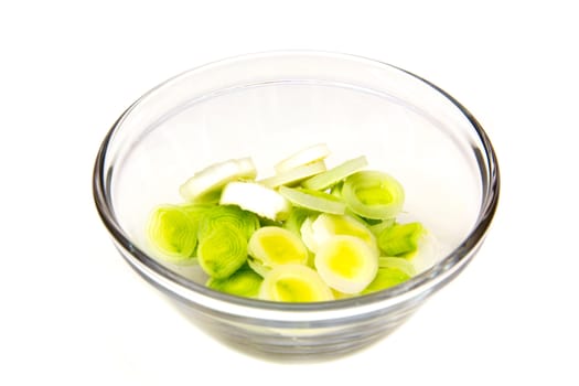 Bowl with sliced leek on a white background